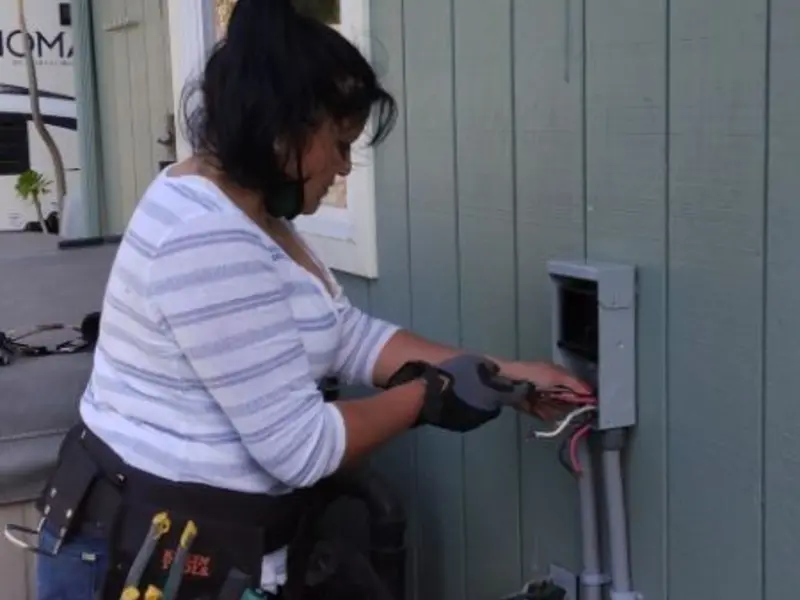 Licensed electrician wiring an exterior subpanel in Hazel Green