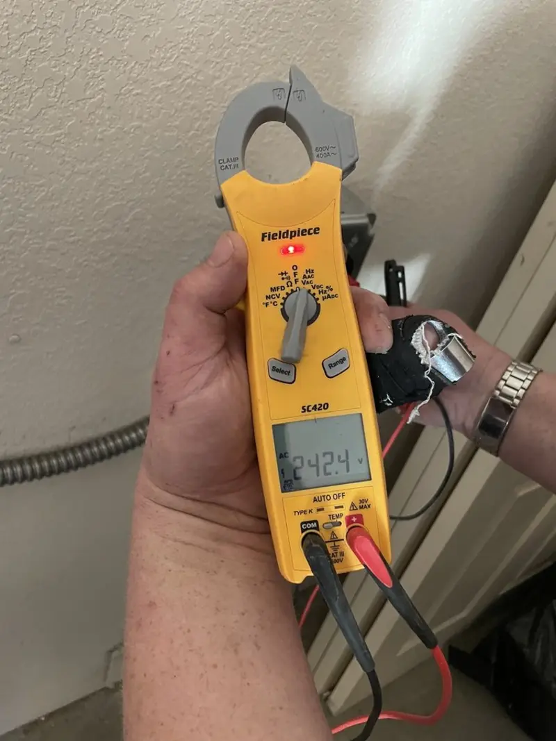 Voltage testing with clamp meter during Electrical Installation Services in Hazel Green
